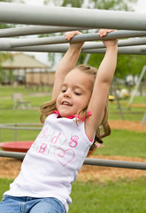 Wall Mural - Little Girl Playing Outside With Big Smile