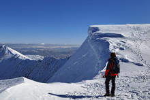 Mountaineer On Snowy Summit