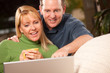 © Andy Dean - Handsome Couple Using Laptop
