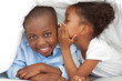 © WavebreakMediaMicro - Cute little girl whispering something to her brother