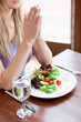© WavebreakMediaMicro - Portrait of a cute woman eating a salad