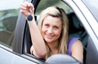 © WavebreakMediaMicro - Attractive young driver holding a key after bying a new car
