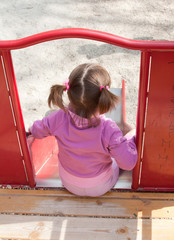 litlle girl on slide