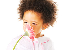Pretty Little Girl Smelling A Flower