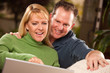 © Andy Dean - Handsome Couple Using Laptop