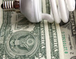 © chere - Power saving up bulb against dollars