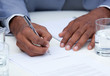 Close-up of ambitious business man signing a contract