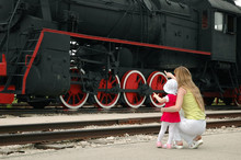 Woman With Child Beside Locomotive