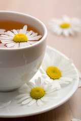 Poster - cup of herbal tea and chamomile flowers