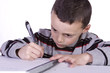 © Mehmet Dilsiz - Little Cute Boy Practicing His Writing Skills