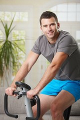 Poster - Man training on exercise bike