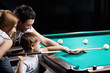 © AboutLife - The family plays billiards
