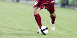 Fototapeta Sport - Soccer players running after the ball