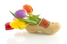 Traditional Dutch Wooden Shoe With Tulips Over White Background