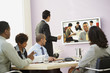 © Blend Images - Multi-ethnic businesspeople having video conference