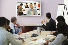 Multi-ethnic Businesspeople Having Video Conference