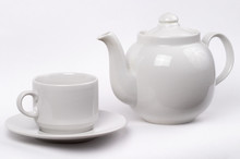 Little White Tea Cup And A Kettle