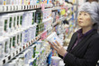 © Noel Hendrickson/Blend Images - Senior Asian woman shopping in grocery store