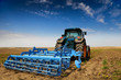 © DeshaCAM - The Tractor - modern farm equipment in field