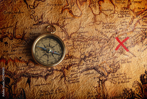 Fototapeta na szkło Compass and a map
