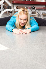 Canvas Print - Woman doing exercises on the floor