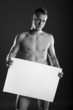 © wtamas - Young naked man holding a space box