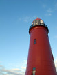 Red lighthouse with blue sky