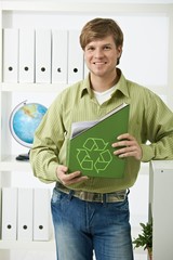 Wall Mural - Young man holding green folder