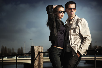 Wall Mural - attractive young couple wearing sunglasses