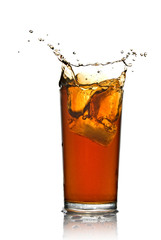 Wall Mural - Beautiful splash of cola in glass isolated on white