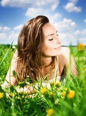 Beautiful Young Woman resting in the park