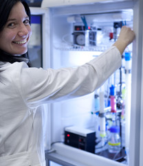 Portrait of a female researcher carrying out research experiment