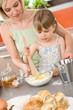 © CandyBox Images - Baking - Woman with child preparing dough