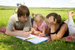 Young family drawing with doughter in the park