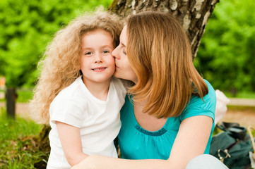 Wall Mural - mother kissing her daughter