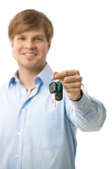 Wall Mural - Young man handing over ignition keys