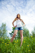 © JackF - teen standing  in dandelion meadow