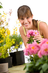 Gardening - smiling woman with flower