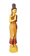 A Large Wooden Statue Of An Eastern Lady On A Plinth.