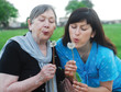 © bit24 - grandmother and granddaughter with dandelions