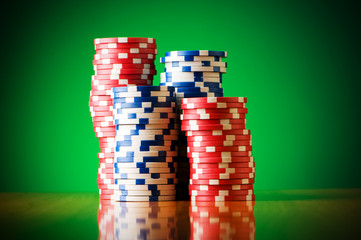 Stack of casino chips against gradient background