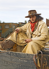 Fototapete - Cowboy Sitting on Wagon