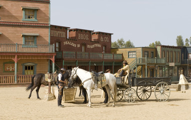 Fototapete - Cowboys watering horses