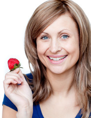 Wall Mural - Delighted woman eating strawberries