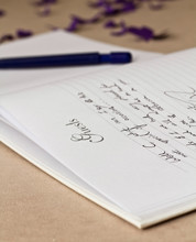 Opened Wedding Guest Book With A Pen