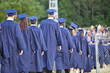 © JudyK - Line of school graduates in blue caps and gowns