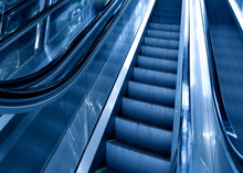 Diminishing Stairway Of Blue Empty Business Escalator