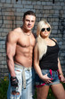 Muscular young man with his girlfriend