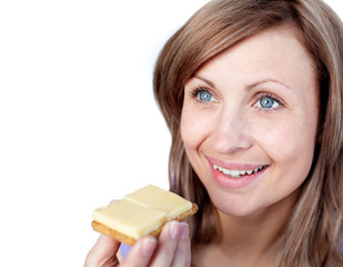 Wall Mural - Cheerful woman eating a cracker with cheese