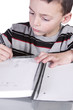 © Mehmet Dilsiz - Little Cute Boy Practicing His Writing Skills